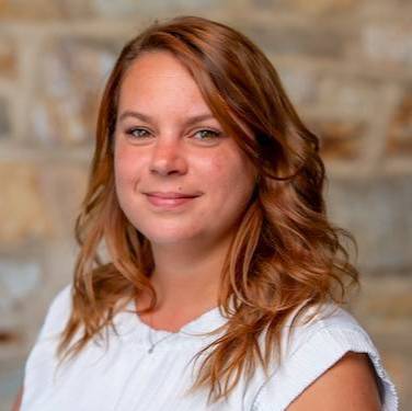 Staff member smiling