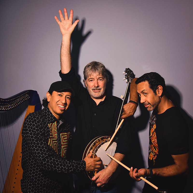 Bela Fleck and BEAT trio band members posing with instruments